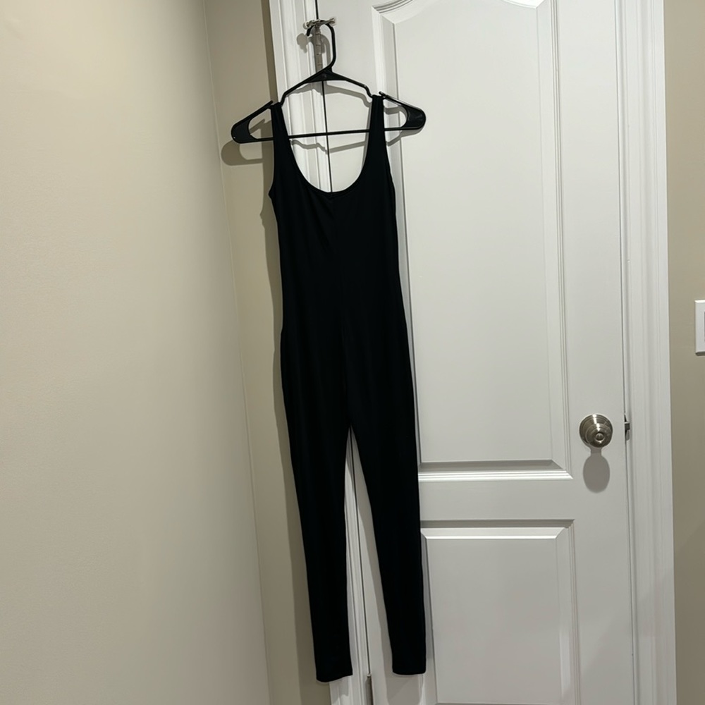 Full body black causal jumpsuit.